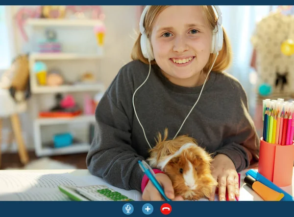 Smiling Modern Child Headphones Guinea Pig Learning Online Having Video — ストック写真