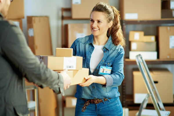 Delivery Business Smiling Young Female Jeans Office Giving Parcel — Stockfoto