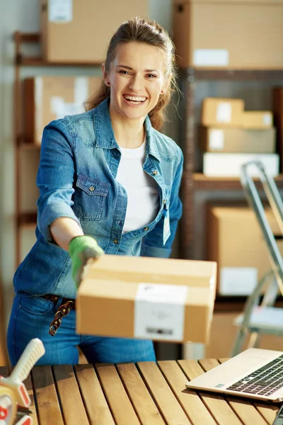 Delivery Business Smiling Modern Woman Jeans Warehouse Giving Parcel — Stok fotoğraf