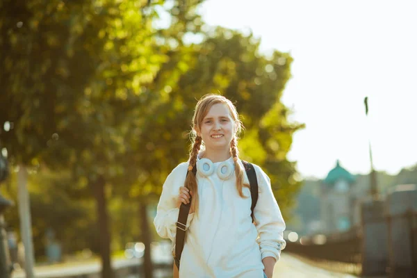 Smiling Stylish Girl White Sweatshirt Backpack Headphones Going School Outdoors — Foto de Stock