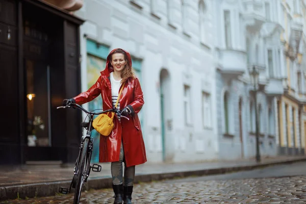 Smiling Elegant Middle Aged Woman Red Rain Coat Bicycle Walking — Fotografia de Stock