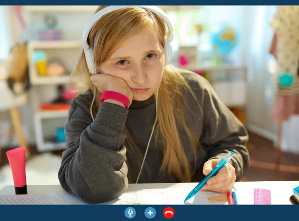 Bored Modern Pupil Headphones Learning Online Having Video Call Home — Stock Photo, Image