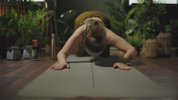 Modern Female Yoga Mat Doing Yoga Modern Green House — 图库视频影像