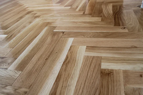自然光茶色の木製の寄木細工の床板質感の背景 — ストック写真