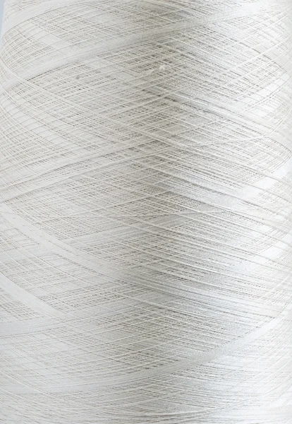 White silk yarn bobbin closeup — Stock Photo, Image