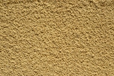 Alçılı duvar cephesi arka plan olarak bej rengine boyanmış.