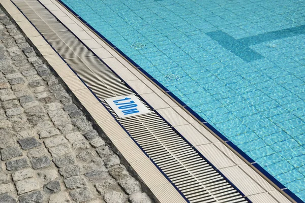 Detail of outdoor swimming pool filled with water closeup