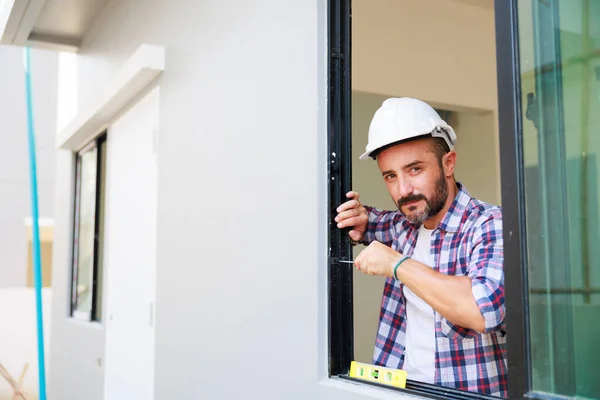 Man Installing Windows New House Construction Site Hispanic Construction Worker — Foto de Stock