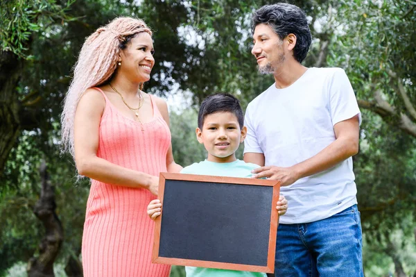 Beautiful Happy Family Holding Blackboard Free Space Text — Stockfoto