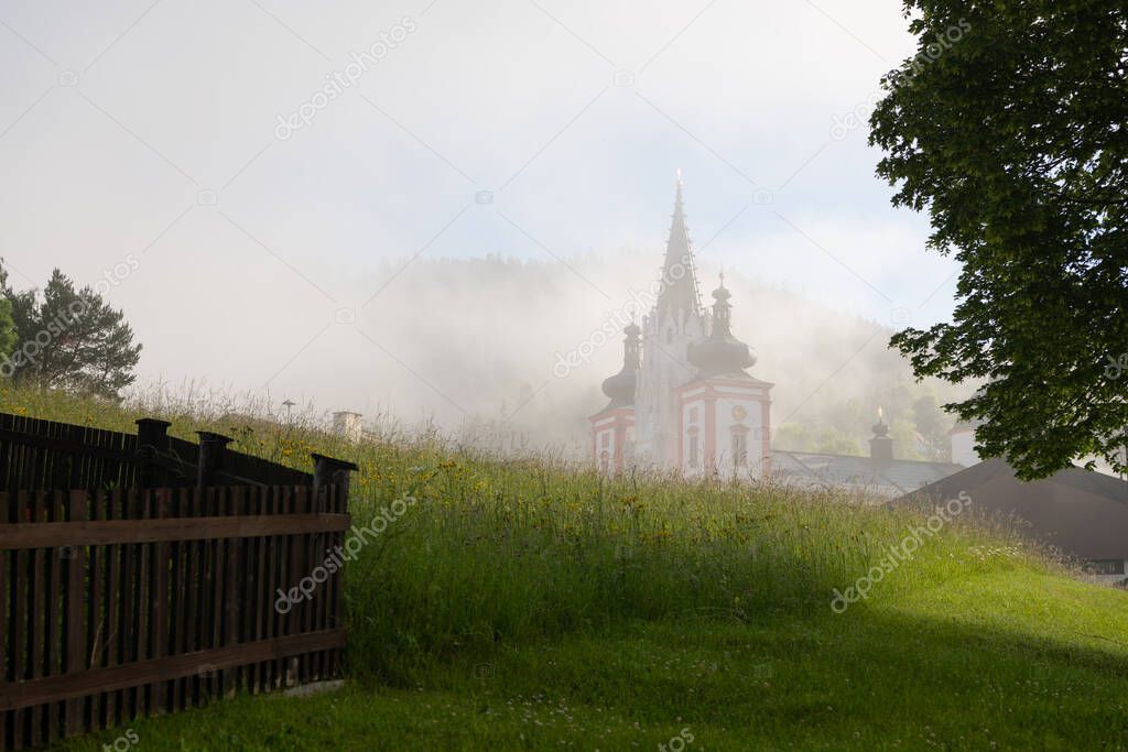 Basilica of the Birth of the Virgin Mary in Mariazell (Austria), foggy morning. This is the most important pilgrimage destination in Austria and one of the most visited shrines in Europe.