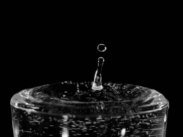 Closeup Single Water Droplet Hitting Surface Black White — Stock fotografie