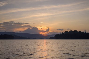 Beautiful colorful sunset at Lake Bunyonyi (Uganda), cloudy sky