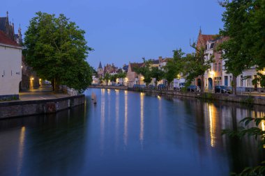 Brugge, Belgium - July 4, 2022: Langerei canal at dawn in summer