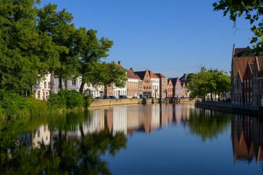 Brugge, Belgium - July 4, 2022: Langerei canal on a sunny day in summer
