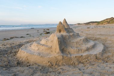 Sand castle on the beach near Cap Gris Nez (France), sunny evening in summer