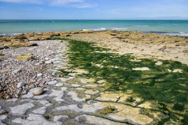 Coast near Cap Gris Nez in northern France on a calm day in summer, interesting rock formations