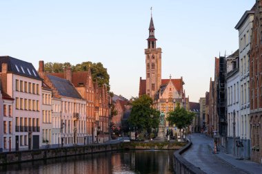 Brugge, Belgium - July 4, 2022: Langerei canal at dawn in summer