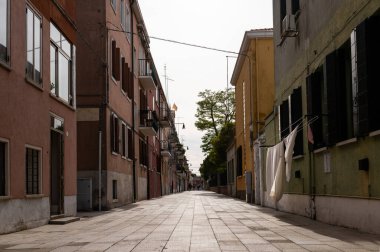 Venice, Italy - October 25, 2021: Street in Murano on a sunny day in autumn