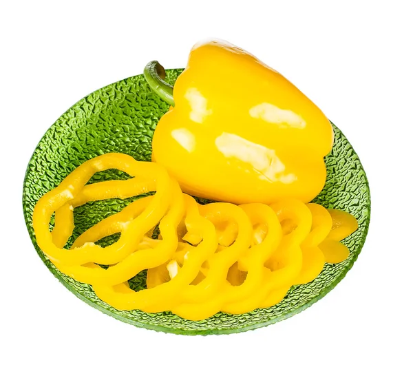 Ripe yellow pepper on green plate — Stock Photo, Image