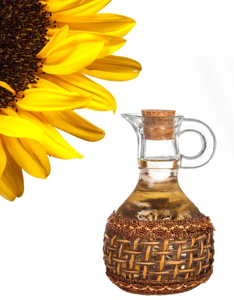 Sunflower and oil jug — Stock Photo, Image