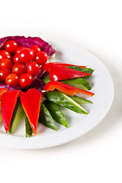 Placa con verduras en rodajas — Foto de Stock