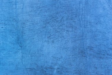 Arka plan olarak kullanılmak üzere maviye boyanmış eski bir beton duvarın fotoğrafı