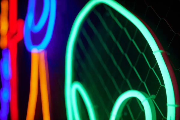 Abstact red neon sign with a blue neon tube. – stockfoto