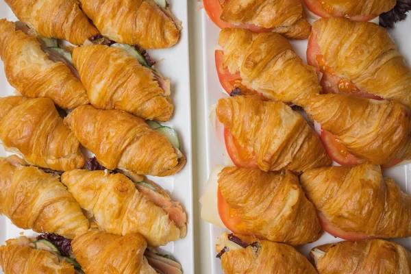 Croissants on a basket weave in a bakery shop. — Stock Photo, Image
