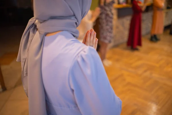 Woman putting hands up and dancing. Excited young female celebrating a victory. Muslim woman in traditional Islamic clothing - hijab. Birthday, New Year celebration concept. — Fotografia de Stock