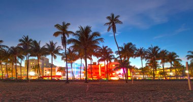 Miami Beach, Florida hotels and restaurants at sunset on Ocean Drive
