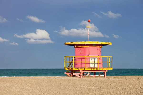 Summer scene in Miami Beach Florida with a colorful lifeguard house