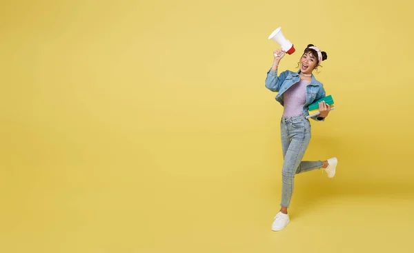 Happy Asian Girl Holding Book Jumping Shouting Announcement Megaphone Yellow — Foto de Stock