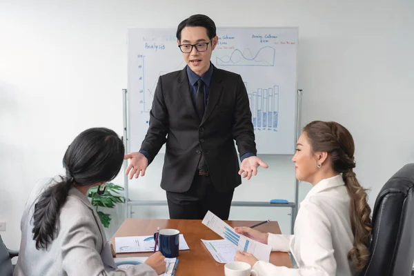 Asian Businesspeople Sit Desk Boardroom Discuss Financial Paperwork Briefing Focused — 图库照片