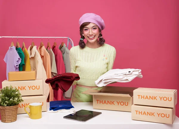 Asian young woman live streaming for sale fashion clothing shopping onling is blogger presenting for social people.Her is influencer in social online.