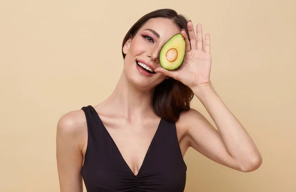 Beauty Woman Holds Half Avocado Front Her Face Photo Attractive Stock Photo
