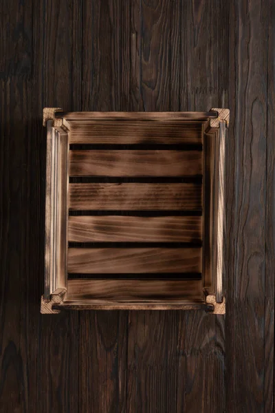 Empty wooden box on wooden table, top view