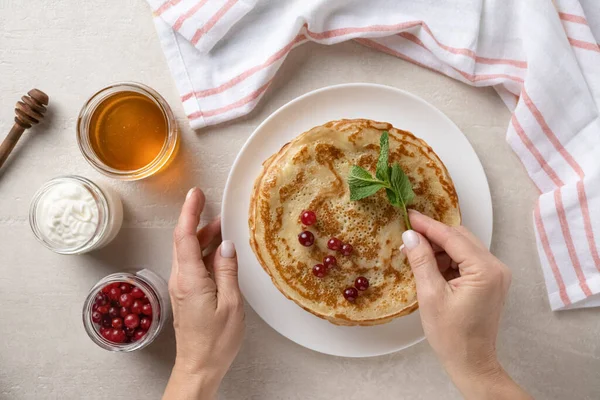 Woman Serves Thin Pancakes Dining Table Shrove Tuesday Top View — Stock Photo, Image