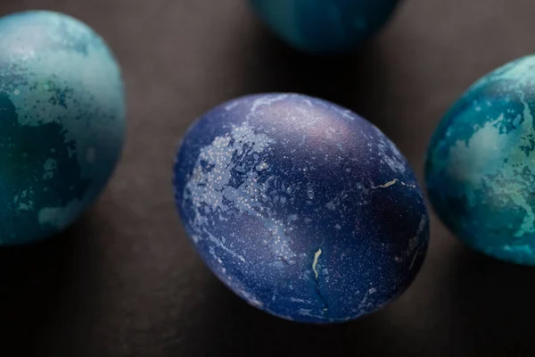 stock image Colored Easter eggs on a dark background. Christian Easter 