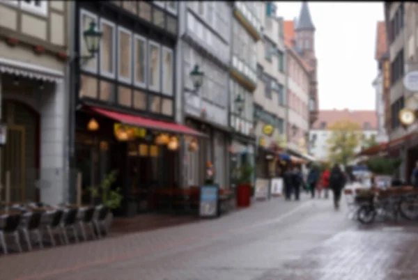 Blur background of german city street with modern and ancient buildings