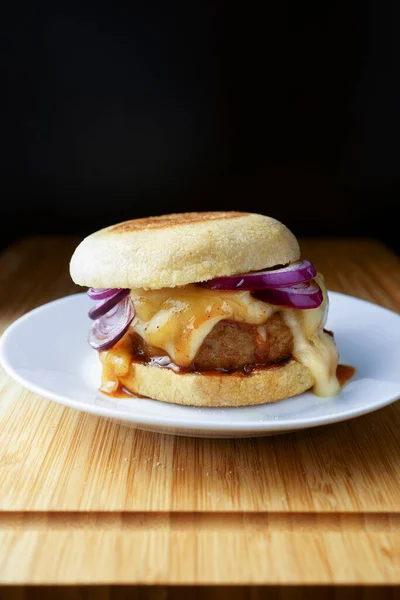 fresh tasty burger homemade or in a fast food cafe served on a plate. Beef burgers or vegan burger closeup, fast food.