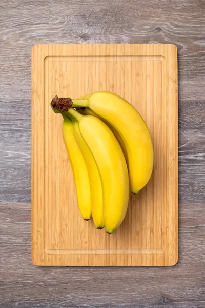 Branch Ripe Bananas Kitchen Board Top View — Zdjęcie stockowe