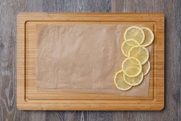 Juicy lemons cut into slices on a kitchen board, close-up, a product with a high content of vitamin C
