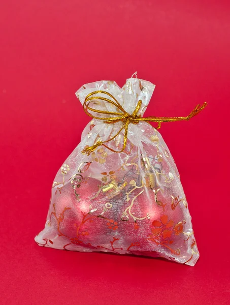 Christmas balls in silver bag — Stock Photo, Image