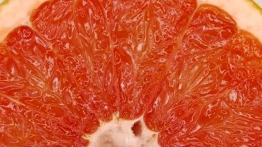 Grapefruit pulp. Citrus fruit close-up. Vitamins and juice from nature.