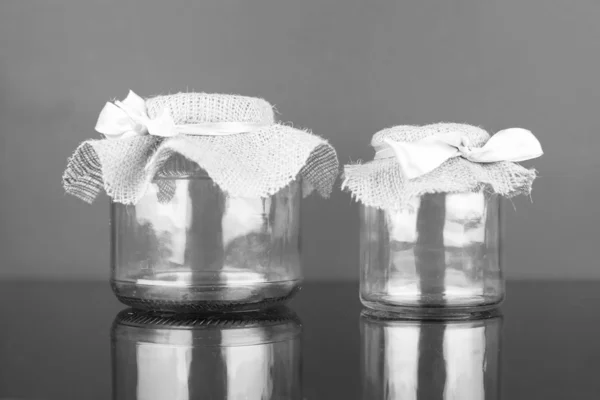 Empty glass jar with packaging sacking