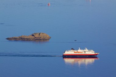 Cruising ship by rock island clipart