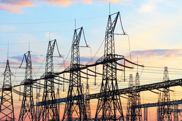 High-voltage support against the sunset sky — Stock Photo, Image