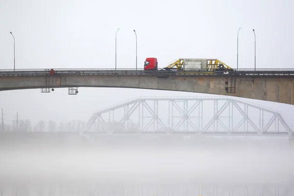 The lorry on the bridge in a fog — Stock Photo, Image