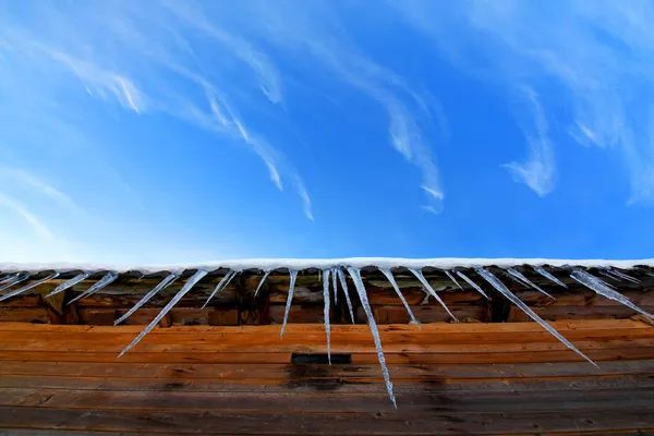 Icicles on a roof — Stock Photo, Image