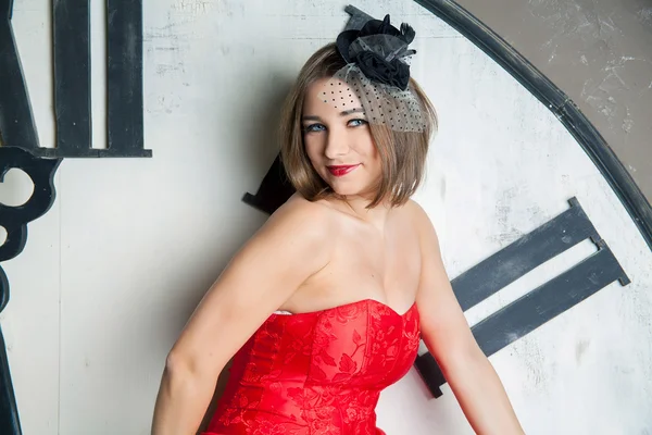 Young beautiful woman in red dress — Stock Photo, Image